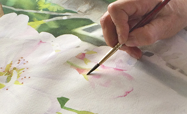 "Heather, a Friday group artist, painting cherry blossoms - whether she thinks so or not, this is sacred practice."